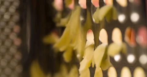 Rubbing Cheese on Grater Extremely closeup Slow Motion 4K Stock Footage 104047930