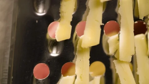 Rubbing Cheese on Grater Extremely closeup Macro shot Stock Footage 104063132