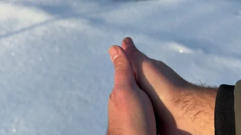 Rubbing Cold Hands Together in Winter Sunlight Stock Footage 327730923
