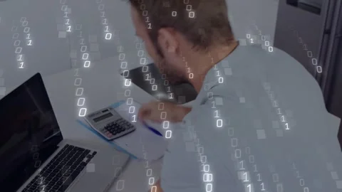Rubbing face, man leaning on kitchen, calculating and writing while binary Video stock 328233471