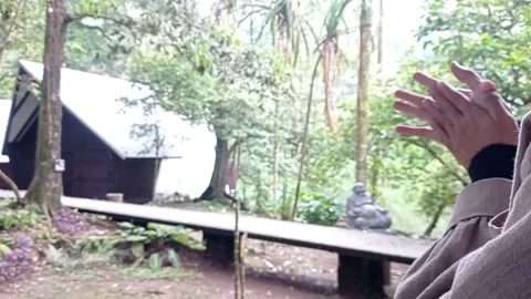 Rubbing hands to make it warm on a rainy day Stock Footage 150215768