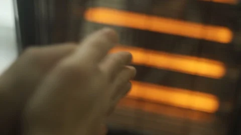 Rubbing hands next to a radiator in winter Stock Footage 108850948