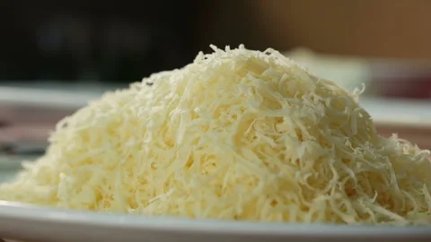 Rubbing hard cheese for pizza. Stock Footage 120912149