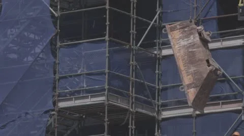 Rubbish bin hanging in front of construction site. Stock Footage 56512425