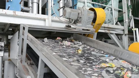 Rubbish on conveyor belt for recycle process Stock Footage