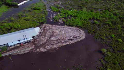 Rubbish dump polluting coastal marshland ecosystem. Best aerial view drone Stock-Footage 344597358