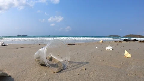 Rubbish Plastic cup left on the beach make pollution in Thailand. Stock Footage 102949953