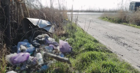 Rubbish on the side of the road. The problem of nature and transport Stock Footage 106068417
