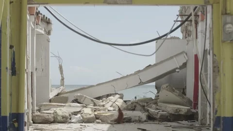 Rubble of a building looking out over the South Coast of Jamaica Stock Footage 340820615