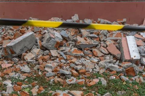 Rubble consisting of red bricks, concrete pieces, and debris Stock Photos