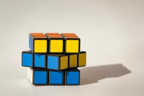 Rubik cube on white background with hard shadow. Business idea concept Stock Photos