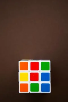 Rubik's cube on brown background with the copy space Foto stock