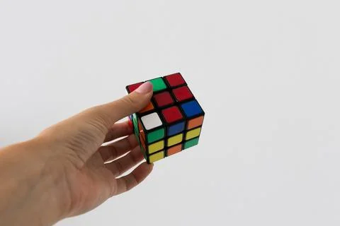 Rubik's cube in hands puzzle task 写真素材