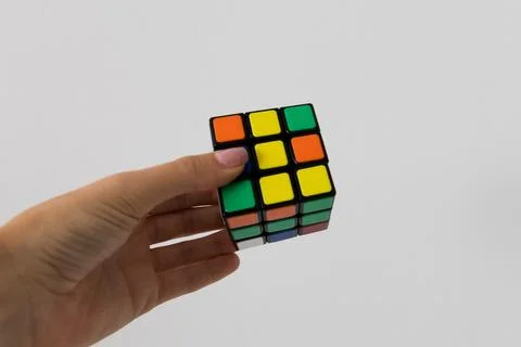 Rubik's cube in hands puzzle task Stock Photos