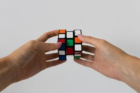 Rubik's cube in hands puzzle task 写真素材