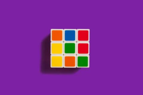 Rubiks Cube on a purple background Stock Photos