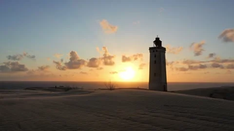 Rubjerg knude lighthouse at sunset on the danish coast Stock Footage 338124640