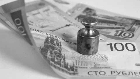 Ruble under pressure concept black and white Stock Footage 323845715