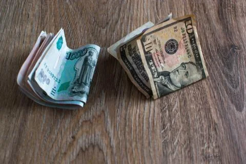 Rubles and dollars on the table Stock Photos