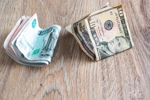 Rubles and dollars on the table Stock Photos
