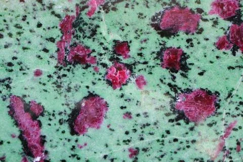 Ruby and ziosite mineral texture Stock Photos