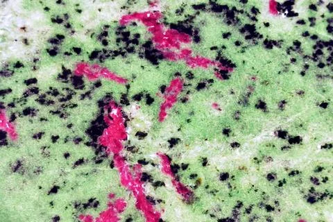 Ruby and ziosite mineral texture Stock Photos