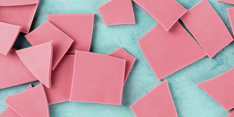 Ruby chocolate, overhead panoramic shot on a blue background Foto stock