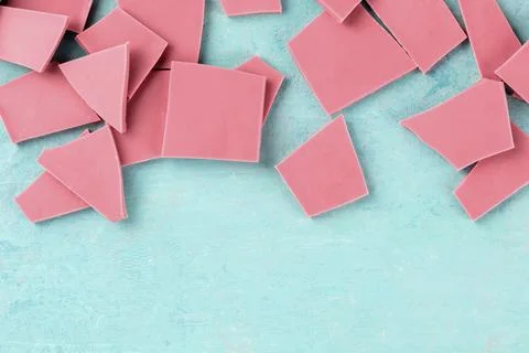 Ruby chocolate, overhead shot on a blue background with copy space Stock Photos