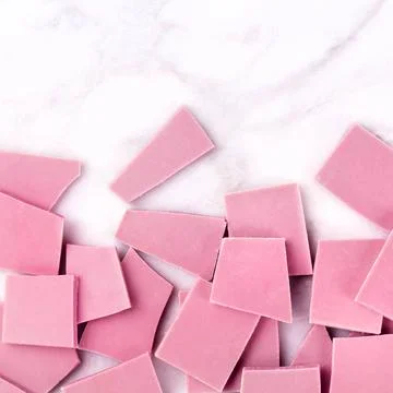 Ruby chocolate, overhead square shot on a white marble background with cop... Stock Photos