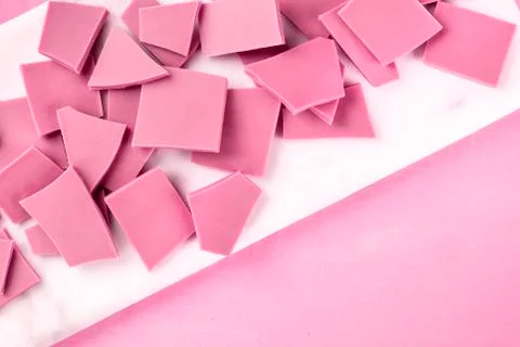 Ruby chocolate, shot from above on a pink background with copyspace Stock Photos