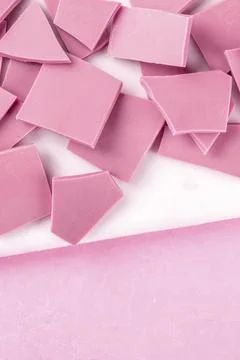 Ruby chocolate, shot from above on a pink background with copy space Foto stock