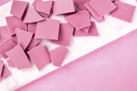 Ruby chocolate, shot from above on a pink background with copyspace Stock Photos