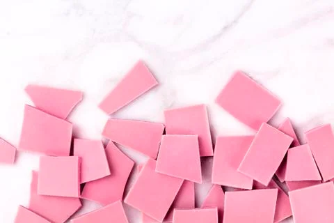Ruby chocolate, shot from above on a white marble background with copy space Foto stock