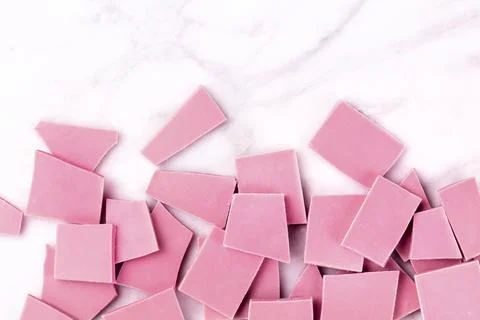 Ruby chocolate, shot from above on a white marble background with copy space Stock Photos
