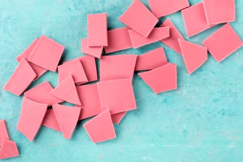 Ruby chocolate, shot from the top on a blue background with a place for text 스톡 사진