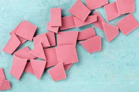 Ruby chocolate, shot from the top on a blue background with a place for te... 스톡 사진
