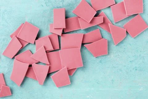 Ruby chocolate, shot from the top on a blue background with a place for text Stock Photos