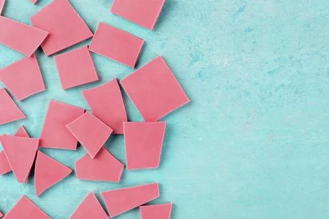 Ruby chocolate, shot from the top on a blue background with a place for text Stock Photos