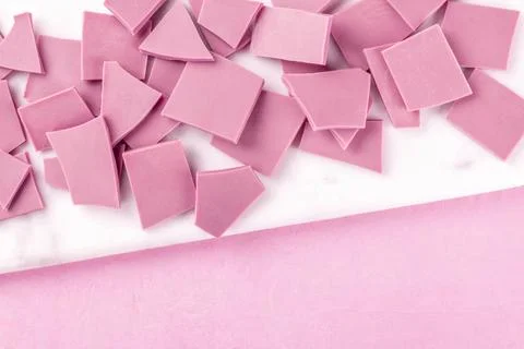 Ruby chocolate, shot from the top on a pink background with a place for te... Stock Photos