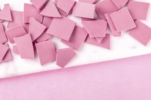Ruby chocolate, shot from the top on a pink background with a place for text Stock Photos