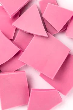 Ruby chocolate slices, a close-up overhead shot of a heap on a white background 写真素材