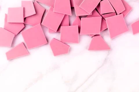 Ruby chocolate slices, shot from above on a white marble background with a place 写真素材