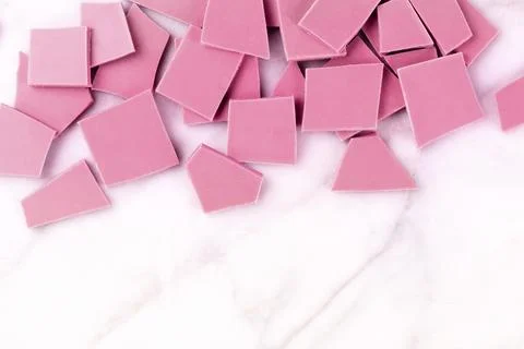 Ruby chocolate slices, shot from above on a white marble background with a place Stock Photos