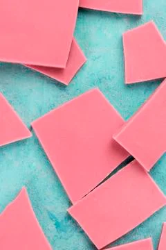 Ruby chocolate slices, top shot on a blue background 스톡 사진