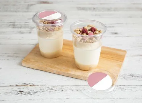 Ruby Chocolate Yogurt Parfaits with Granola and Berries in cups on wooden b.. Stock Photos