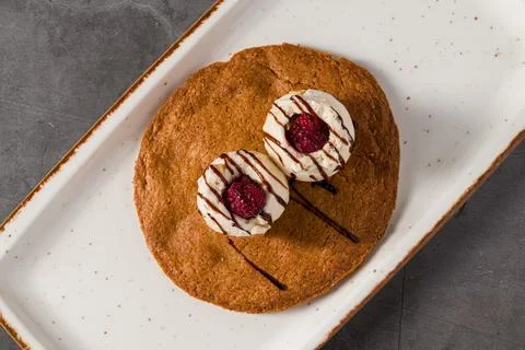 Ruby cookie dessert topped with vanilla ice cream and chocolate Stock Photos