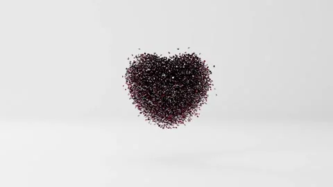 A ruby ​​diamond heart shines, turns and crumbles into many red diamond gemstone Stock Footage 259296310
