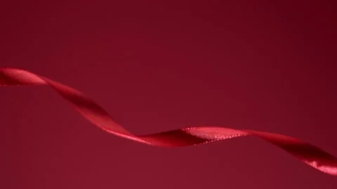 Ruby fabric satin glossy strip moving in front of a matte backdrop. 4k high Stock Footage 144324267