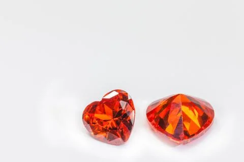 Ruby gemstones in heart shape on white background Stock Photos
