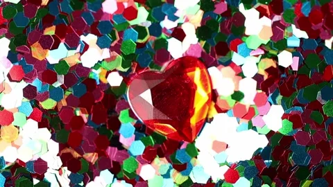 Ruby heart on a background of multicolored sequins Stock Footage 165408397